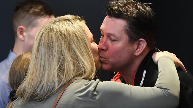 Joanne and Brett Ratten seal the Saints’ new coaching job with a kiss. Picture: AAP