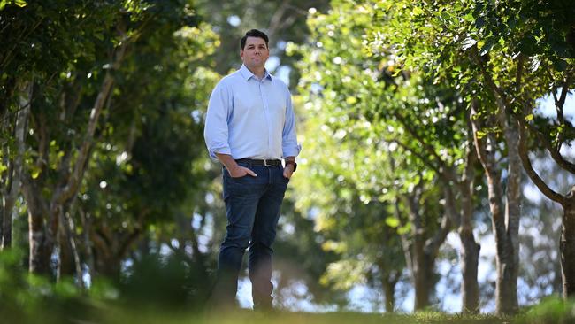 Rio Tinto Chief Decarbonisation Officer Jonathon McCarthy flanked by Pongamia trees. The Pongamia pilot will explore the potential of Pongamia seed oil as a feedstock for renewable diesel, a cleaner alternative to traditional fossil fuels. Rio Tinto will develop Pongamia seed farms in North Queensland as part of a new biofuels pilot. The project encompassing 3000 hectares of land will explore the potential of Pongamia seed oil as a feedstock for renewable diesel, a cleaner alternative to traditional fossil fuels. Picture: Supplied