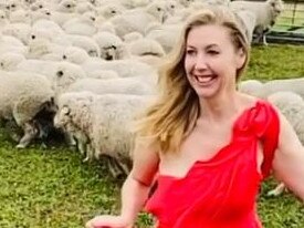 Catriona Rowntree dons a full length red gown  at her farm near Geelong. Picture: Instagram