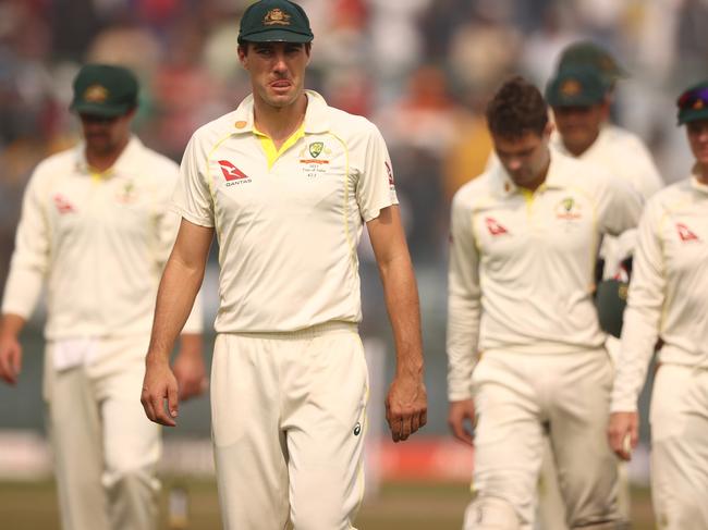 DELHI, INDIA - FEBRUARY 19: Pat Cummins of Australia leads the team off the ground after they were defeated by India during day three of the Second Test match in the series between India and Australia at Arun Jaitley Stadium on February 19, 2023 in Delhi, India. (Photo by Robert Cianflone/Getty Images)