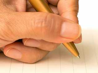 Women writing on paper with a pen on a white background. Picture: wisawa222