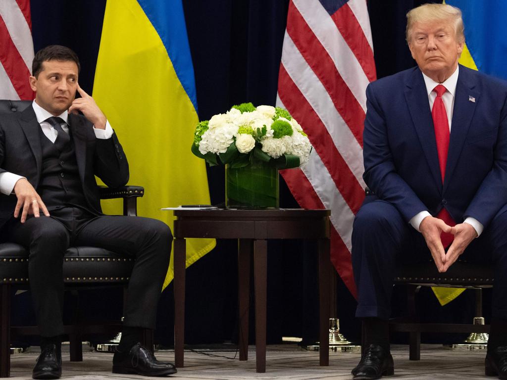 US President Donald Trump and Ukrainian President Volodymyr Zelensky had a phone call which is now the centre of an impeachment inquiry that Mr Trump has called a “scam”. Picture: AFP