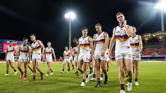 Crows players contemplate their first ever loss to Gold Coast.