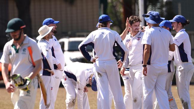 Nick Murray of Banyule takes the wicket of Rosanna’s Dalton Marsh.Picture: Hamish Blair