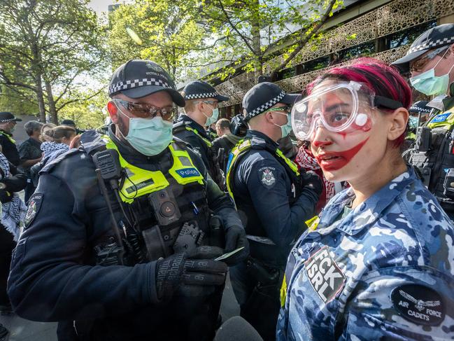 Police search and question protesters on Thursday. Picture: Jake Nowakowski