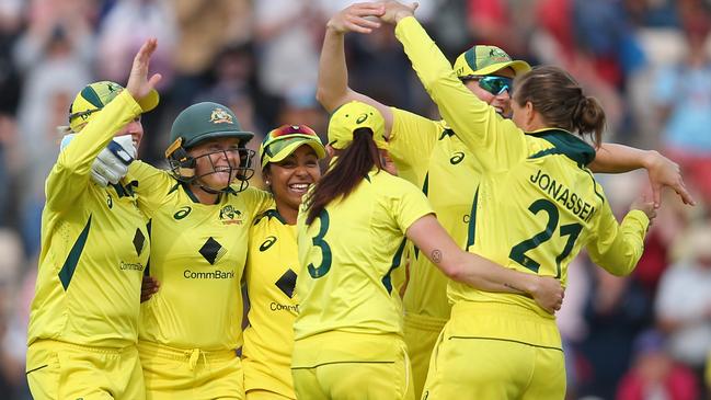 Australian players celebrate their three-run victory over England in the Women‘s Ashes second ODI match. The Aussies have retained the trophy. Picture: Steve Bardens/Getty Images