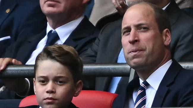 Britain's Prince George of Wales (L) and Britain's Prince William, Prince of Wales attend the English FA Cup final football match between Manchester City and Manchester United at Wembley stadium, in London, on May 25, 2024. (Photo by Ben Stansall / AFP) / NOT FOR MARKETING OR ADVERTISING USE / RESTRICTED TO EDITORIAL USE