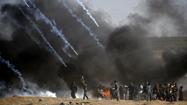 Teargas is fired at Palestinian protesters during violent clashes with Israeli forces on May 14 of this year. Picture: AAP