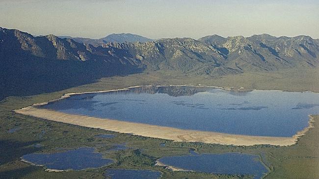 The original Lake Pedder, including its unique 3km long, almost 1km wide pink quartzite beach, which now sits under 15 metres of water. The lake was flooded for a hydro-electric scheme in 1972 but there is an ongoing campaign to restore the lake to its original level – and bring the amazing beach back to life. Picture: Elspeth Vaughan