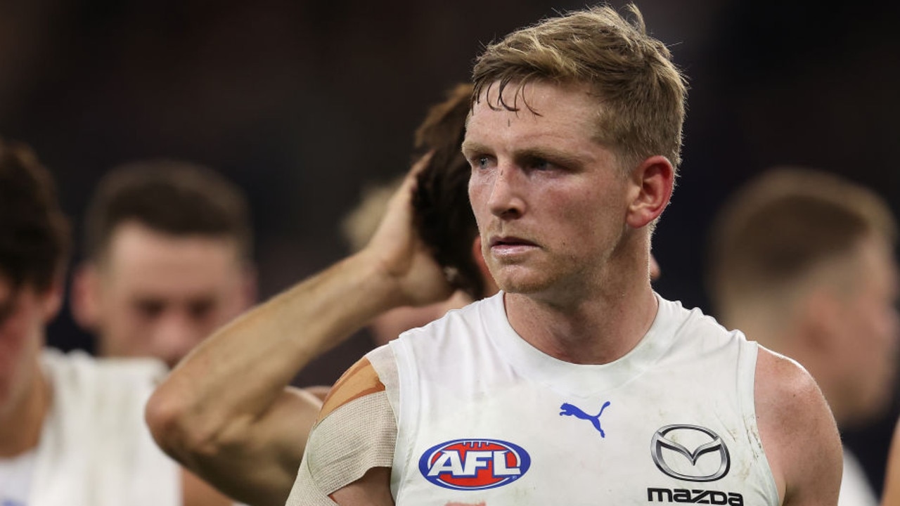 PERTH, AUSTRALIA - MAY 06: Jack Ziebell of the Kangaroos leads the team from the field after being defeated during the round eight AFL match between the Fremantle Dockers and the North Melbourne Kangaroos at Optus Stadium on May 06, 2022 in Perth, Australia. (Photo by Paul Kane/Getty Images)