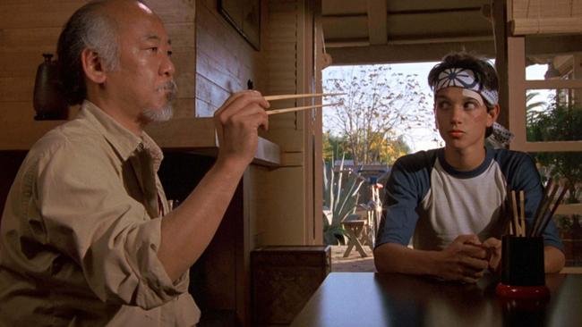 Pat Morita and Ralph Macchio in The Karate Kid.