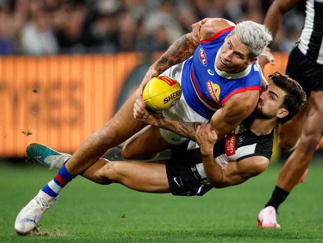 Josh Daicos brings Rory Lobb to ground in a tackle. Picture: Dylan Burns/AFL Photos via Getty Images