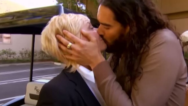 Russell Brand appeared to pull Hayes close to him before planting a kiss on her lips. Picture: Nine