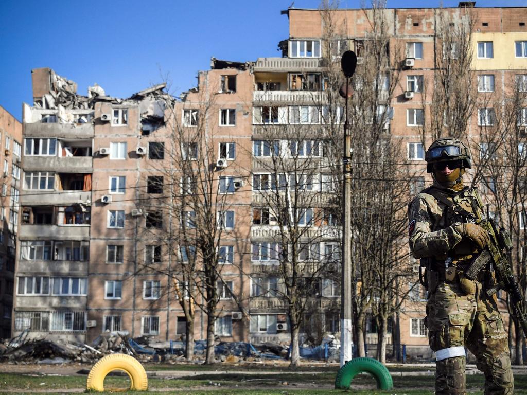 A Russian soldier stands in front of an apartment building in Donetsk. Picture: AFP