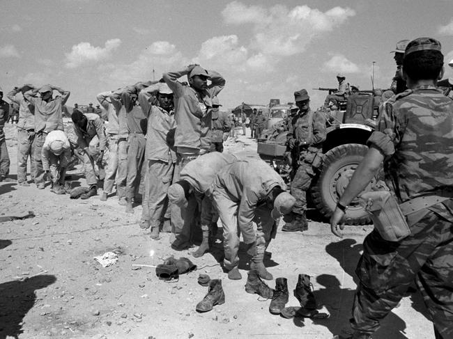 JUNE, 1967 : Egyptian prisoners are rounded up by Israeli troops after being captured near Al Arish in the Sinai during the Six Day War in 06/67 (1967) in photo released by the Government Press Office. Four decades after an underdog Israeli military campaign that captured the world's imagination, Israelis, Middle East and the world are are still struggling to come to terms with it.Egypt / Israel / Armed Forces / ArmyHistorical