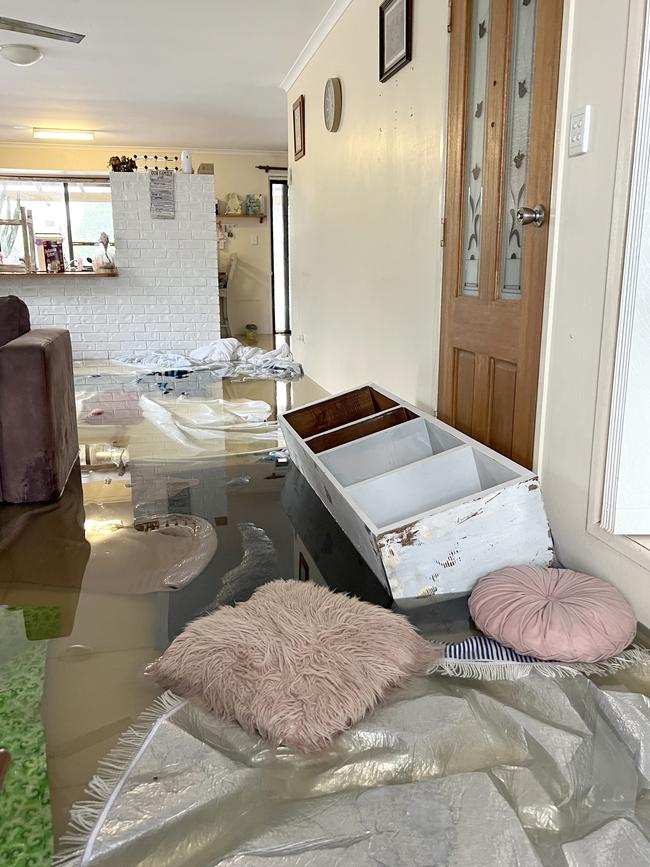 Water gushed into the Glasshouse Mountains home, uprooting the furniture. Picture: Nicolette Stewart