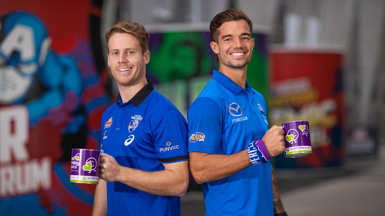 Jy Simpkin (right) and Western Bulldogs wingman Lachie Hunter hope to raise lots of money for the Royal Children’s Hospital from their Good Friday SuperClash. Picture: Jason Edwards