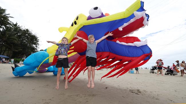 Liam Miller, 6, and Blake Miller, 7, marvel at the size of the kites on Four Mile Beach when the attended Port Douglas Carnivale's family beach day on Saturday. Picture: Brendan Radke