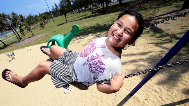 Emilee Teao-Clark enjoys the swings at Len Fox Park, Labrador. Pics Adam Head 