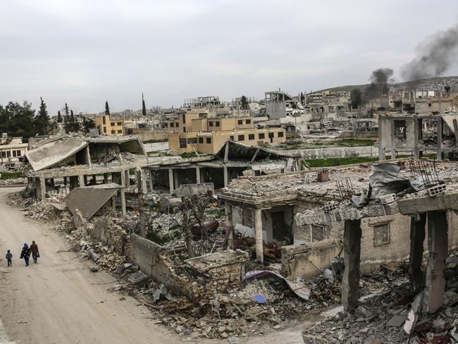 A neighbour in ruins ... the Syrian town of Kobane, pictured on March 27, 2015. Picture: AFP Photo / Yasin Akgul