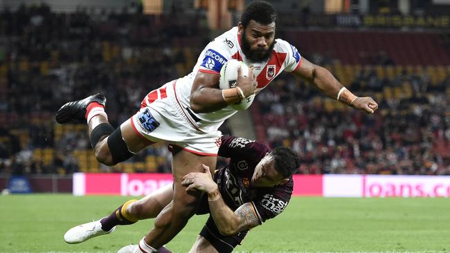 Mikaele Ravalawa forces his way over to score for the Dragons against Brisbane at Suncorp Stadium. Picture: Getty Images