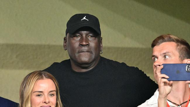 US former basketball player Michael Jordan (C) attends the UEFA Champions League 1st round day 1 football match between AS Monaco and FC Barcelona at the Louis II Stadium in the Principality of Monaco on September 19, 2024. (Photo by Miguel MEDINA / AFP)