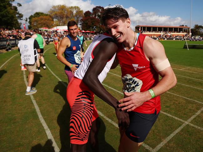 Gout Gout and Lachlan Kennedy embrace at the Stawell Gift. Picture: Morgan Hancock/Getty Images