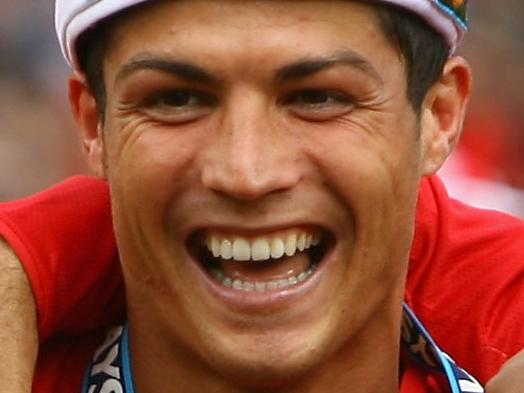 MANCHESTER, ENGLAND - MAY 16: Cristiano Ronaldo of Manchester United celebrates winning the Barclays Premier League trophy after the Barclays Premier League match between Manchester United and Arsenal at Old Trafford on May 16, 2009 in Manchester, England. (Photo by Alex Livesey/Getty Images)