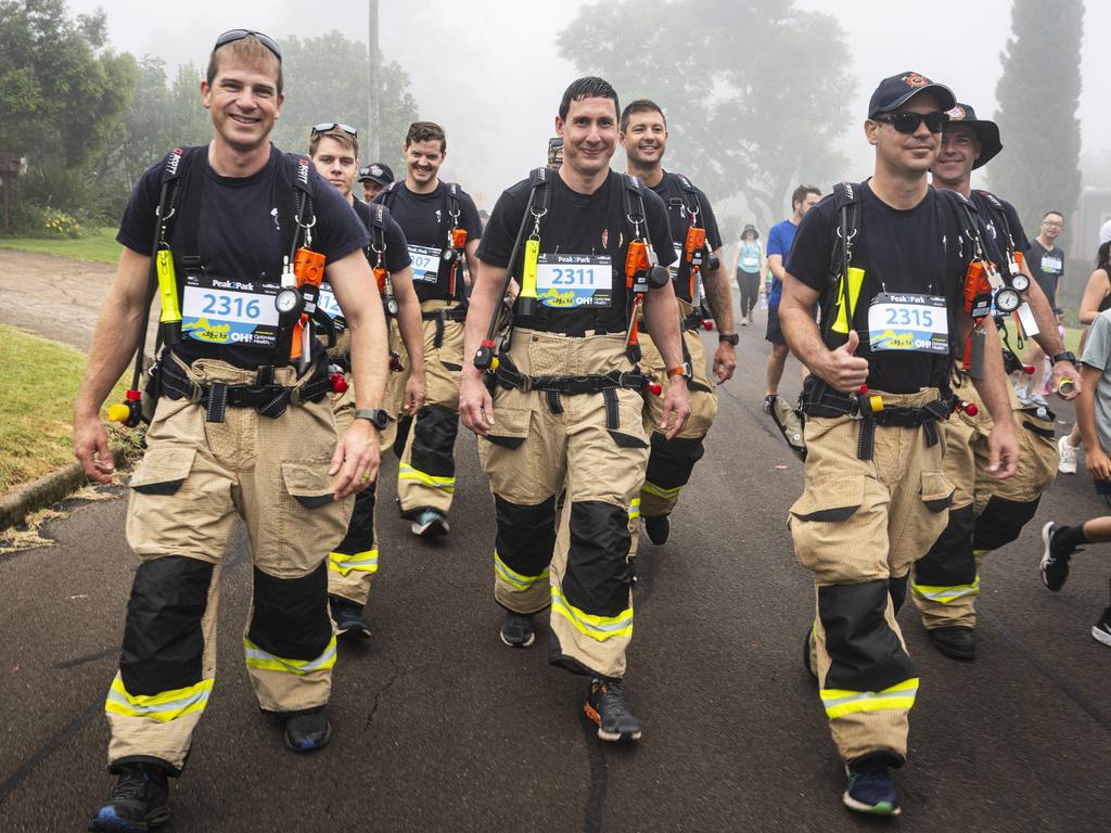 QFES firefighters walk the 4km Peak2Park in turn out gear, Sunday, March 3, 2024. Picture: Kevin Farmer