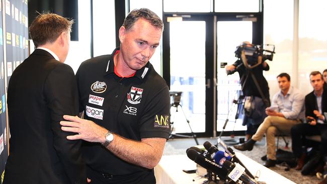 Sacked Saints head coach Alan Richardson brushes past club chief executive Matt Finnis as he leaves a press conference announcing his sacking. Picture: Getty Images