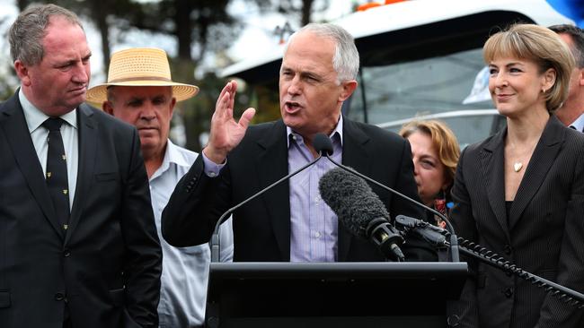 Nationals leader Barnaby Joyce, Senator John Williams (rear), and Employment Minister Senator Michaelia Cash listen as PM Malcolm Turnbull addresses truckies at an anti-RSRT rally of owner/drivers at Exhibition Park in Canberra.