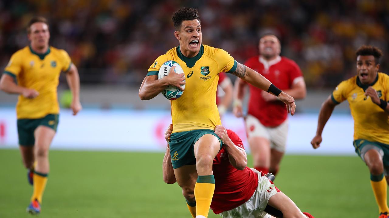 Matt To’omua of Australia is tackled during the Rugby World Cup.