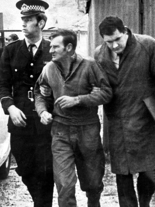 Clifford Cecil Bartholomew being arrested by police.