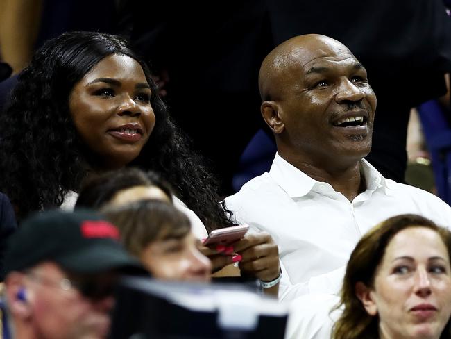 Mike Tyson watches on in the crowd at the US Open.