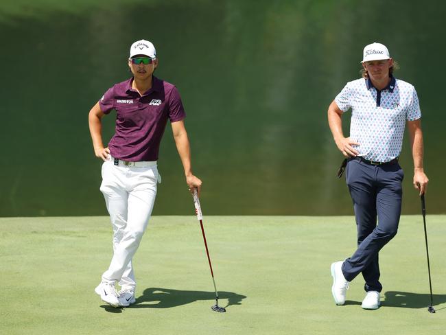 SYDNEY, AUSTRALIA - DECEMBER 01: Min Woo Lee and Cameron Smith of Australia look on while on the 9th green during the ISPS HANDA Australian Open at The Australian Golf Course on December 01, 2023 in Sydney, Australia. (Photo by Mark Metcalfe/Getty Images)