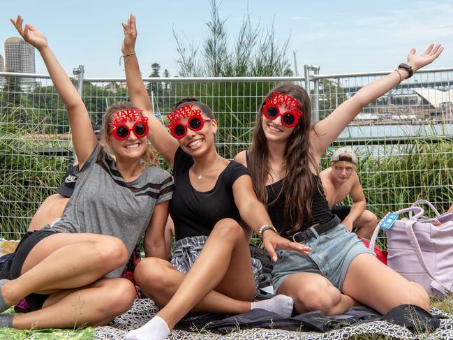 Visitors from Germany in Sydney to celebrate New Years Eve Jana Haeusler, Karima Goldstein & Nadine GrŸ§er pictured at Mrs Macquaries chair around 10am this morning and were waiting in line since 6am to get their spot. Monday December 31 2018 ( Image / Monique Harmer)