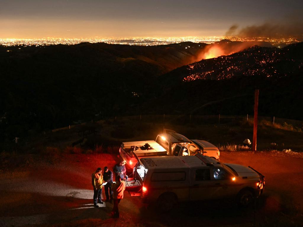 At least 16 people died as multiple fires ripped through residential areas of LA in destruction that US President Joe Biden likened to a ‘war scene’. Picture: Patrick T. Fallon/AFP