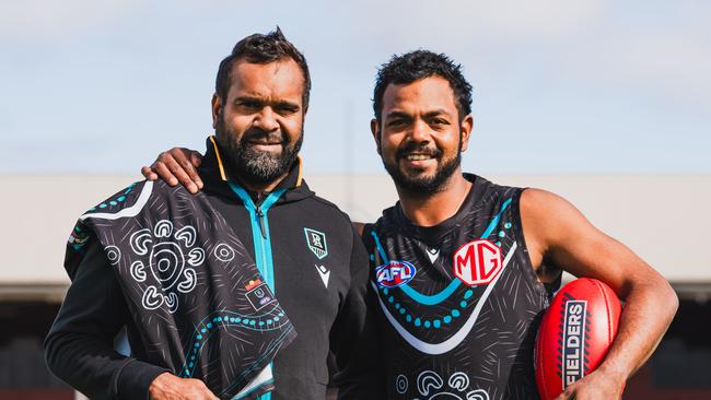 Byron Pickett and Willie Rioli with Port Adelaide's 2024 Indigenous guernsey for Sir Doug Nicholls Round. Picture: Matt Sampson