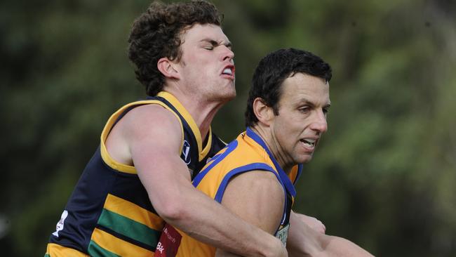 Previous life ... James Keogh throws himself into his defender role for St Kevins in 2011 against a Steve Carrell in Foxcatcher lookalike.