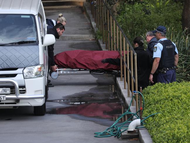 The body is taken away from the scene in Vaucluse about 3pm on Friday. Picture: Max Mason-Hubers