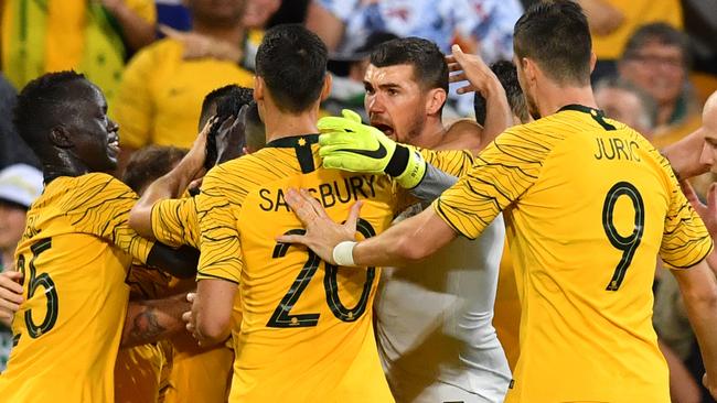 Massimo Luongo of the Socceroos celebrates scoring a goal with teammates during the International friendly match between Australia and the Korea Republic at Suncorp Stadium, in Brisbane, Saturday, November 17, 2018. (AAP Image/Darren England) NO ARCHIVING, EDITORIAL USE ONLY