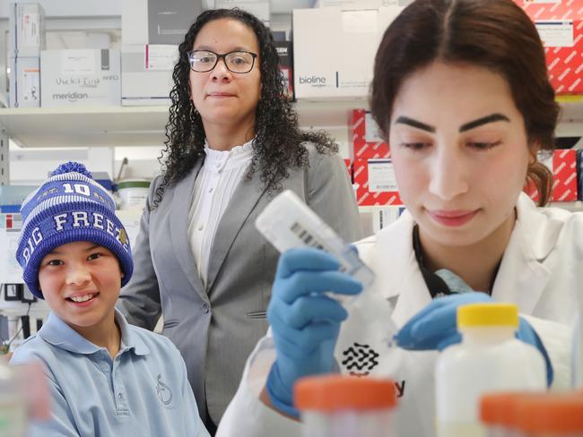 Dr Margreet Ridder at the Florey institute has won an award named in honour of the late Dr Ian Davis to continue her research into motor neurone disease (MND). Dr Davis helped establish FightMND. Dr Ridder is pictured with his son Archie Davis, (10) and his widow Mel. Picture: David Crosling, ,