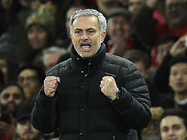 Manchester United's Portuguese manager Jose Mourinho reacts after Manchester United's Belgian midfielder Marouane Fellaini scored his team's second goal during the EFL (English Football League) Cup semi-final football match between Manchester United and Hull City at Old Trafford in Manchester, north west England on January 10, 2017. / AFP PHOTO / Oli SCARFF / RESTRICTED TO EDITORIAL USE. No use with unauthorized audio, video, data, fixture lists, club/league logos or 'live' services. Online in-match use limited to 75 images, no video emulation. No use in betting, games or single club/league/player publications. /