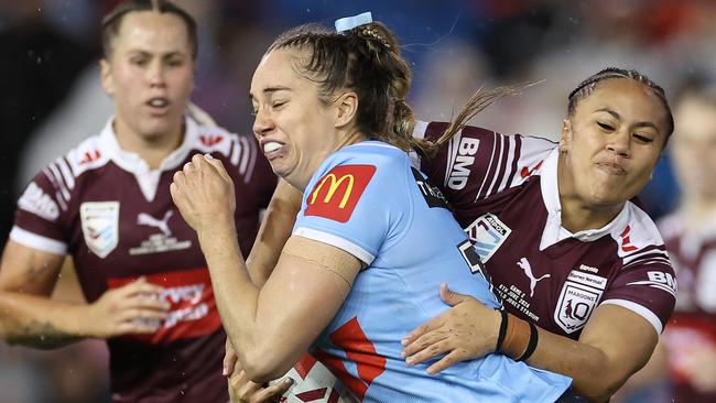 NEWCASTLE, AUSTRALIA - JUNE 06:  Kezie Apps of the Blues is tackled during game two of the Women's State of Origin series between New South Wales Sky Blues and Queensland Maroons at McDonald Jones Stadium on June 06, 2024 in Newcastle, Australia. (Photo by Cameron Spencer/Getty Images)