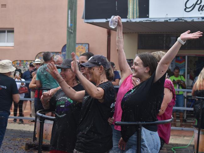 The Apple and Grape Festival grape crush competitors show off for the crowd, 1 March, 2024