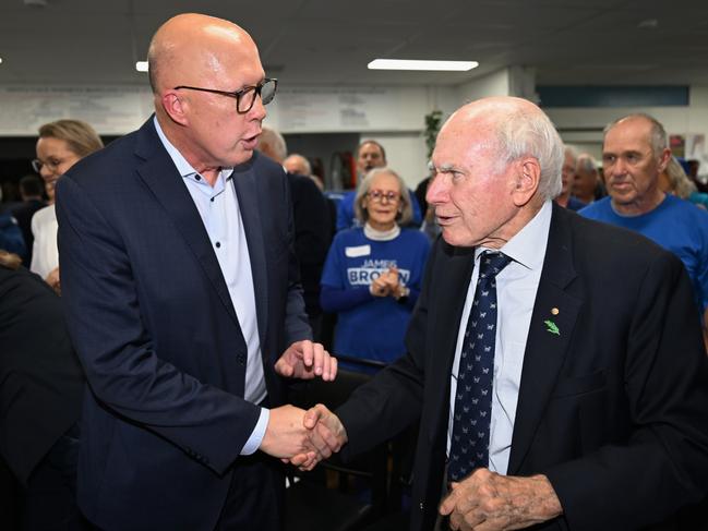 SYDNEY, AUSTRALIA - APRIL 27: Opposition Leader Peter Dutton shakes hands with Former Prime Minister John Howard during a Liberal Party campaign launch in the seat of Mackellar on April 27, 2025 in Sydney, Australia. Australia will head to the polls on May 3, early voting for the 2025 Australian election has also been highly successful, with more than 524,000 people casting their ballots on the first day alone-breaking previous records. (Photo by Dan Peled/Getty Images)