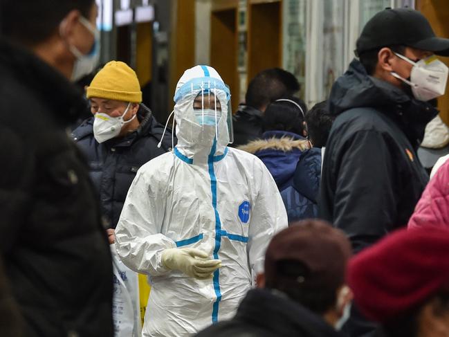 A medical staff member walking at the Wuhan Red Cross Hospital in Wuhan. Picture: Hector Retmal/AFP