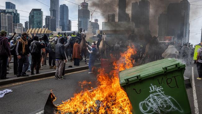 Anti-war activists protest the Land Forces 2024 International Land Defence Exposition at the Melbourne Convention and Exhibition Centre. Picture: Jake Nowakowski