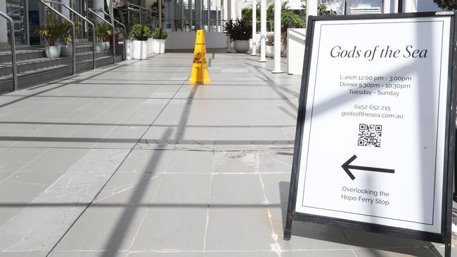 An empty restaurant, without tables and chairs, and a left out sign are all that remains of Gods of the Sea at Marina Mirage. Picture: Glenn Hampson