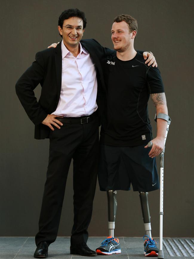 Dr Al-Muderis’ osseointegration surgery provides amputees with a leg replacement that is meant to be as close to the human anatomy as possible, increasing their mobility and quality of life. Here he is pictured with patient Michael Swain, 24, a British Army double amputee who he fitted with new alloy legs.